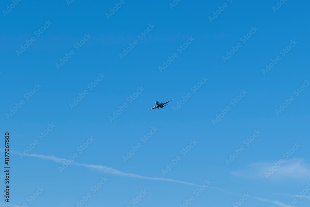 Commercial aircraft high in the sky landing grar down heading for Prestwick Airport in Ayrshire Scotland Commercial aircraft high in the sky landing grar down heading for Prestwick Airport in Ayrshire Scotland