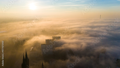 Enchanting Sunset Over Tarnow City Shrouded in Heavy Fog photo