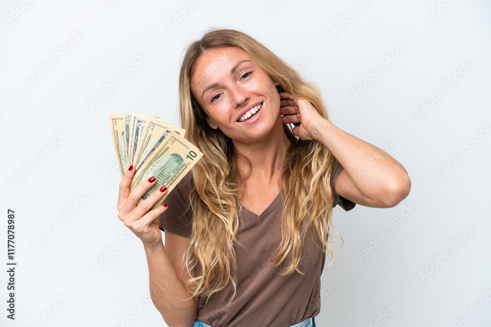 Young Russian woman taking a lot of money isolated on white background laughing Young Russian woman taking a lot of money isolated on white background laughing