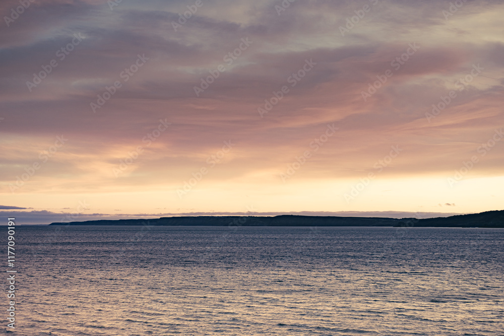 Fototapeta premium Headland In A Sunset.