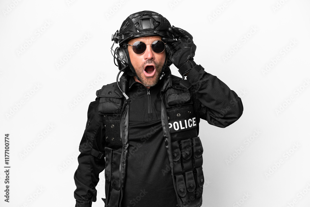 Middle age SWAT man isolated on white background with glasses and surprised Middle age SWAT man isolated on white background with glasses and surprised