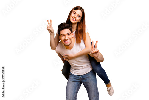 Portrait of his he her she two nice attractive cheerful cheery optimistic people having fun vacation holiday showing v-sign isolated over vivid shine bright yellow background photo