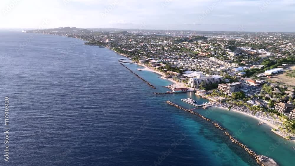 Beautiful sunny day over Curacao's beaches with boats and turquoise seas captured by drone. Beautiful sunny day over Curacao's beaches with boats and turquoise seas captured by drone.