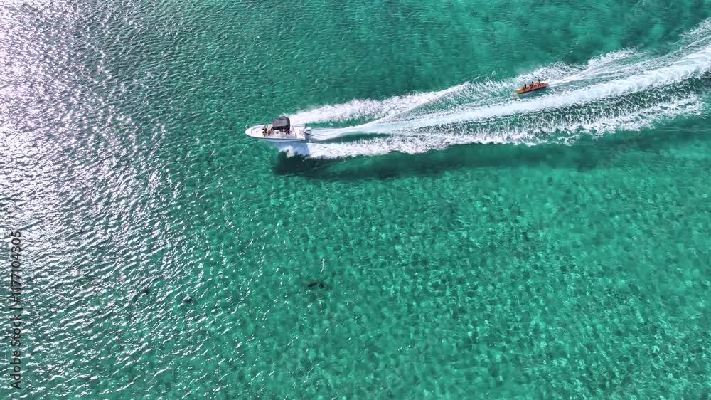Breathtaking aerial view of Grand Cayman's tropical coastline and resort beaches in clear weather. Breathtaking aerial view of Grand Cayman's tropical coastline and resort beaches in clear weather.