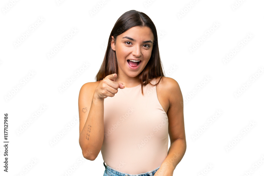 Fototapeta premium Young caucasian woman isolated on green chroma background surprised and pointing front