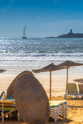 Fototapeta Naklejka Na Ścianę i Meble -  Palapas and chair installed the beach of Essaouira in the west of Morocco