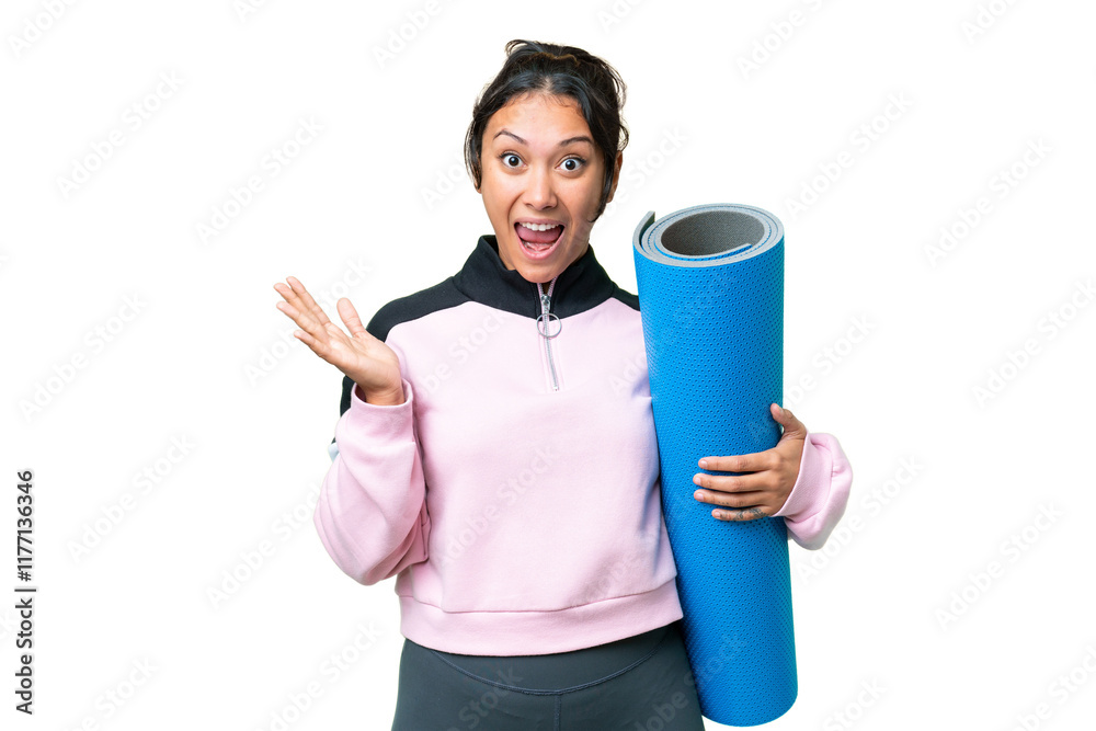 Young sport woman going to yoga classes while holding a mat over isolated chroma key background with shocked facial expression Young sport woman going to yoga classes while holding a mat over isolated chroma key background with shocked facial expression