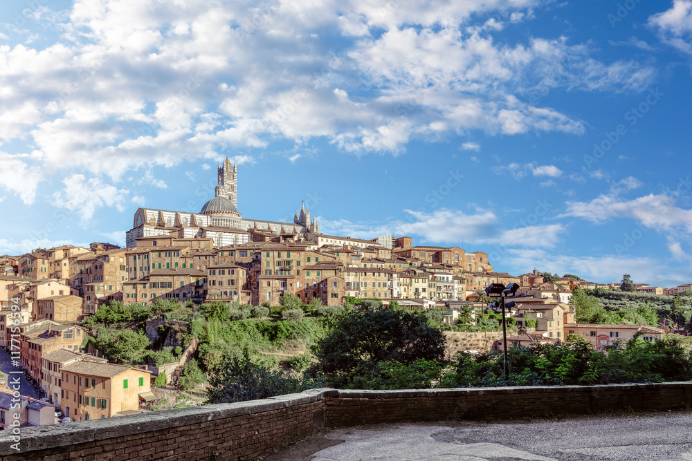 View of Siena City in Tuscany showcasing medieval architecture and scenic landscape under a clear blue sky