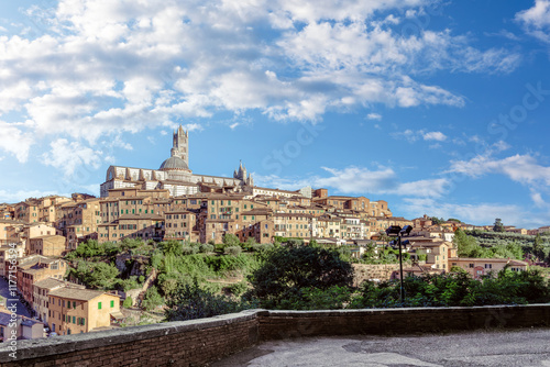 Obraz na płótnie View of Siena City in Tuscany showcasing medieval architecture and scenic landscape under a clear blue sky w salonie