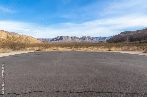 Beautiful wide angle view of the B4 road between Lüderitz and Keetmanshoop near Garub in Namibia, Africa. The road cuts through the famous Namib Desert. Mountains in the background. photo