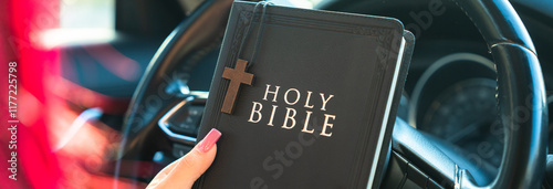 Canvas Print Woman in car holding Bible, safe driving, God's protection