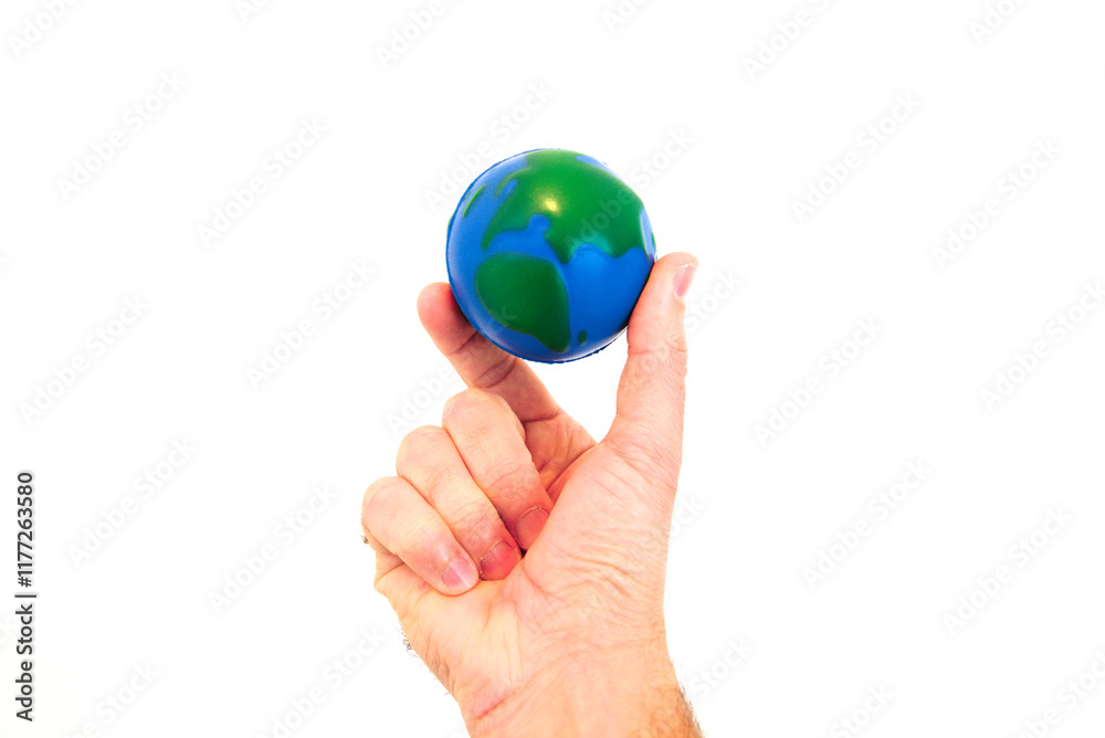 Hand Holding a Foam Globe Against a White Background Hand Holding a Foam Globe Against a White Background