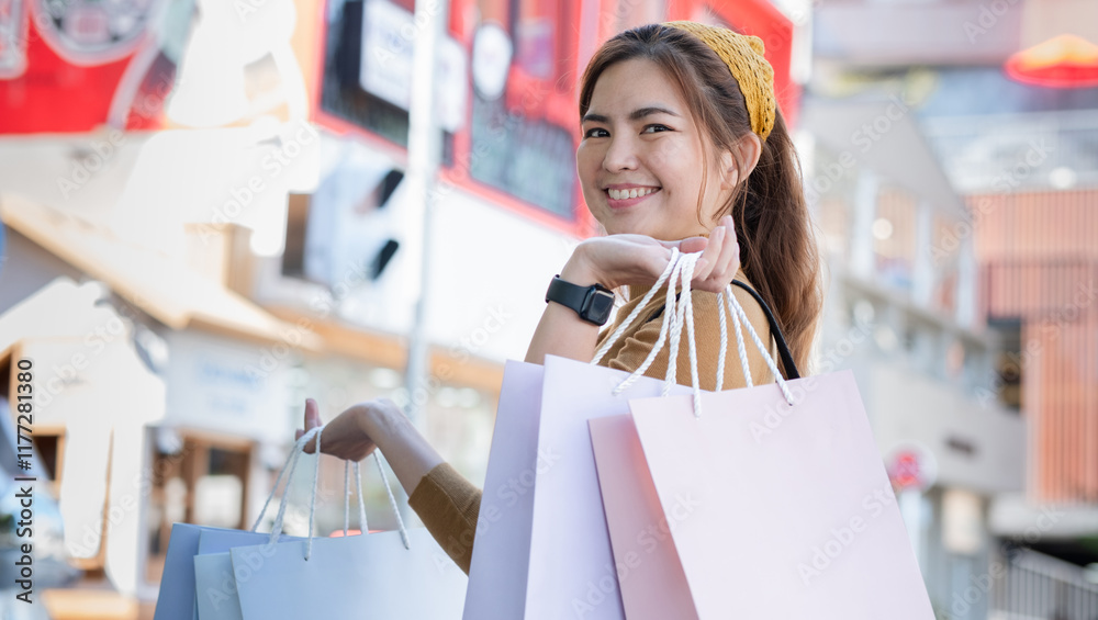 Young Woman Enjoying a Day of Shopping with Multiple Bags in Urban Setting, Smiling and Fashionably Dressed, Reflecting Modern Lifestyle Young Woman Enjoying a Day of Shopping with Multiple Bags in Urban Setting, Smiling and Fashionably Dressed, Reflecting Modern Lifestyle
