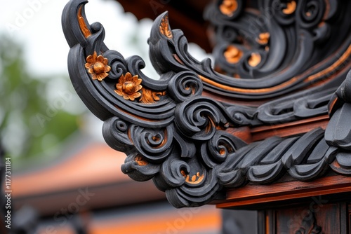 A detailed close-up of the intricate gable apex (chofa) of a Thai ubosot, showcasing its elegant curves and gold accents photo