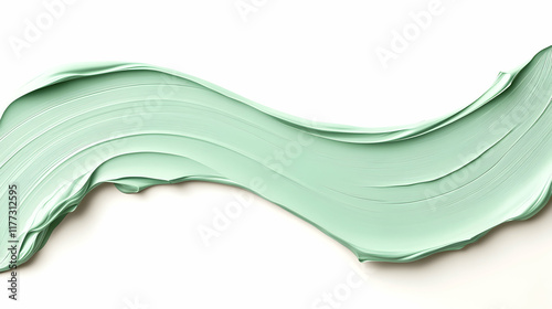 Mint green cream swirl on white background; cosmetic product texture, ideal for beauty or skincare advertising. photo