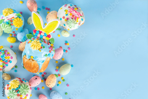 Bright colorful Easter cakes, pastries and eggs greeting card background with copy space,  Easter cooking concept, sweet treats sale, Easter party, spring baking fair invitation photo