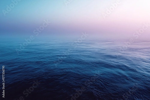 Wallpaper Mural Misty sunrise over calm ocean with subtle pink and blue hues Torontodigital.ca