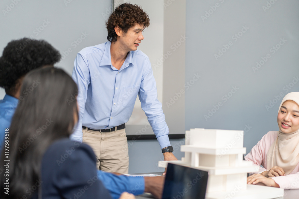 Architects engineers collaborating on building design project in modern office, diverse team of professionals female muslim architect and male engineers discussing architectural model of structure Architects engineers collaborating on building design project in modern office, diverse team of professionals female muslim architect and male engineers discussing architectural model of structure