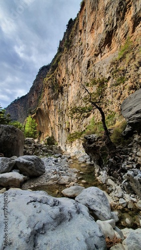 Majestic Samaria Gorge In Crete: One Of The Longest And Most Breathtaking Natural Gorges In Europe Surrounded By Towering Cliffs, Lush Vegetation, And Ancient Trails photo