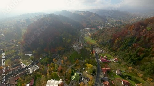 Stunning aerial view over the Bran Castle, Transylvania, Romania on a partial cloudy day. Wonderful autumn vibe.