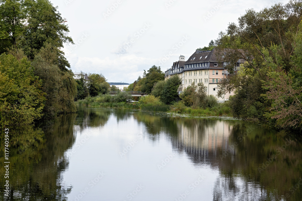 View along the river Lahn in Wetzlar with reflections in autumn View along the river Lahn in Wetzlar with reflections in autumn