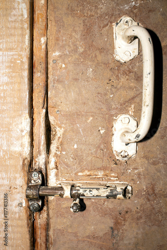 The latch is an old Soviet one.The door latch.The latch for the door.Shutter photo.