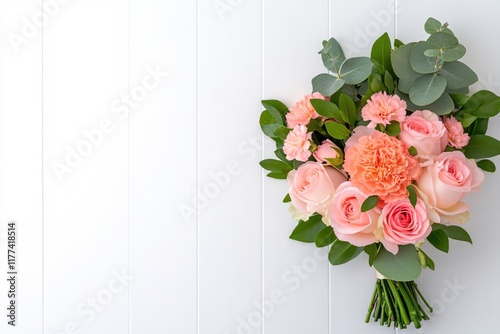 Beautiful bouquet of pink roses and carnations with green leaves on white background