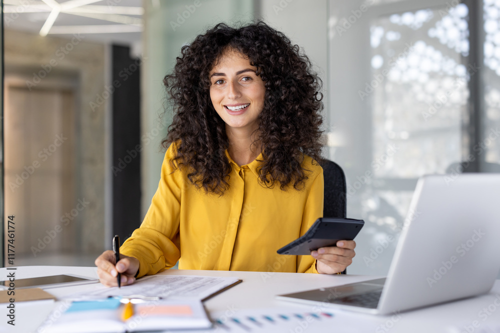 © Liubomir - Paperwork, businesswoman writing data in spreadsheet and filling out tax forms, woman inside office using laptop, financier accountant preparing financial investment report, smiling looking camera © Liubomir - Paperwork, businesswoman writing data in spreadsheet and filling out tax forms, woman inside office using laptop, financier accountant preparing financial investment report, smiling looking camera