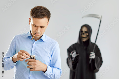 Terrible grim reaper visits a man smoking cigarettes, highlighting the deadly consequences, like lungs cancer of tobacco use. Interaction between the smoker and the symbol of death. photo