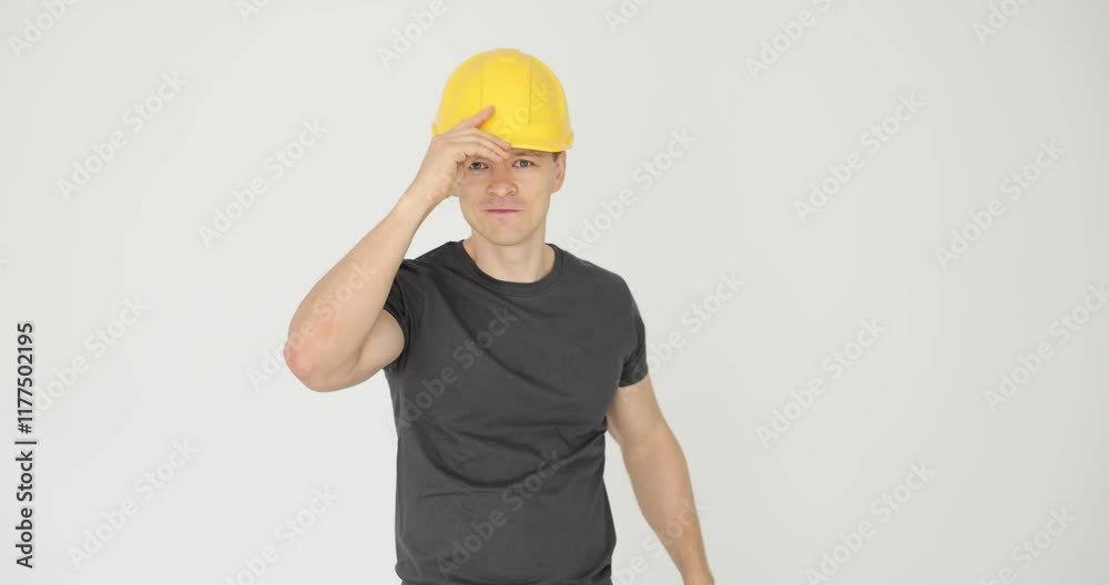 Builder man in yellow hard hat holding thumbs up Builder man in yellow hard hat holding thumbs up