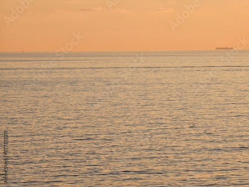 Wallpaper Mural Genova, Italy - December 29, 2024: Background of beautiful sunset over Mediterranean sea waves. Selective focus. Beautiful red and orange sunrise over the sea. Beautiful seascape scenery, Amazing ligh Torontodigital.ca