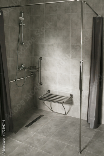 Modern accessible bathroom with grab bars, a wall-mounted shower seat designed for individuals with mobility challenges.