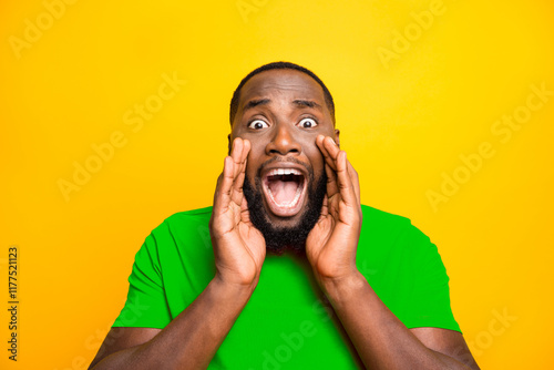 Close up photo of screaming panic terrified frightened black man shouting you to inform about something while isolated with yellow background