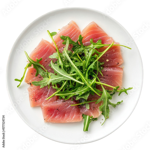 plate of thinly sliced raw fish. likely tuna. arranged artfully with fresh arugula on top. garnished with black pepper. suggesting a focus on culinary presentation and freshness photo