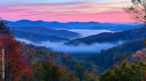 Scenic mountain landscape at sunrise, with layers of mist and vibrant colors creating a serene and breathtaking view  photo