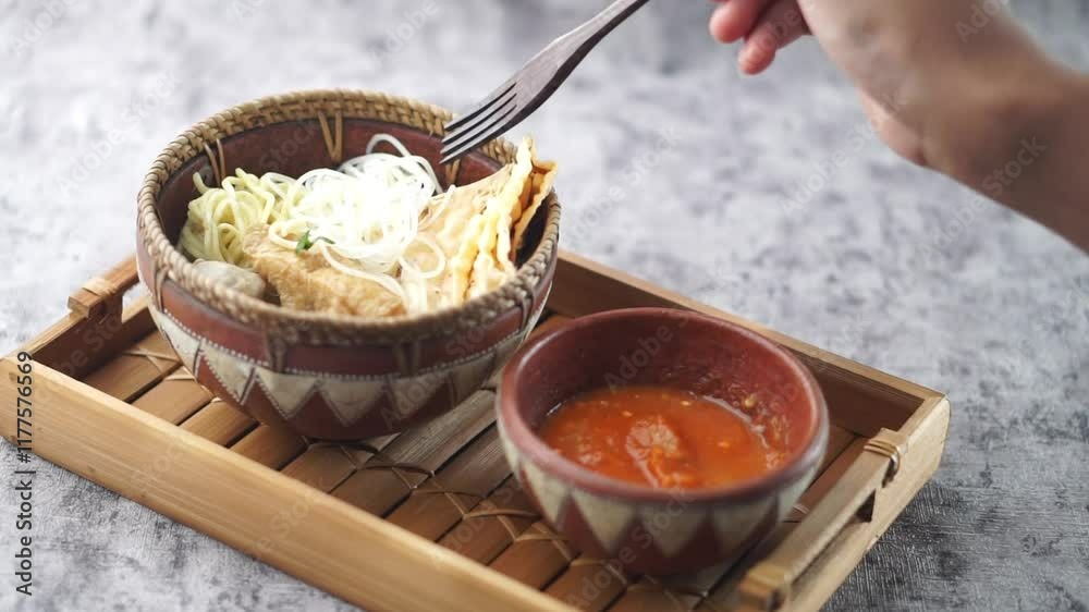 Malang Meatballs served with a spicy chili sauce in a rustic and charming arrangement, showcasing cultural culinary art and delicious cuisine