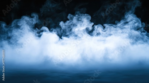 Abstract white smoke vapor swirling against a black background creating a mystical foggy atmosphere for artistic or culinary presentations.
