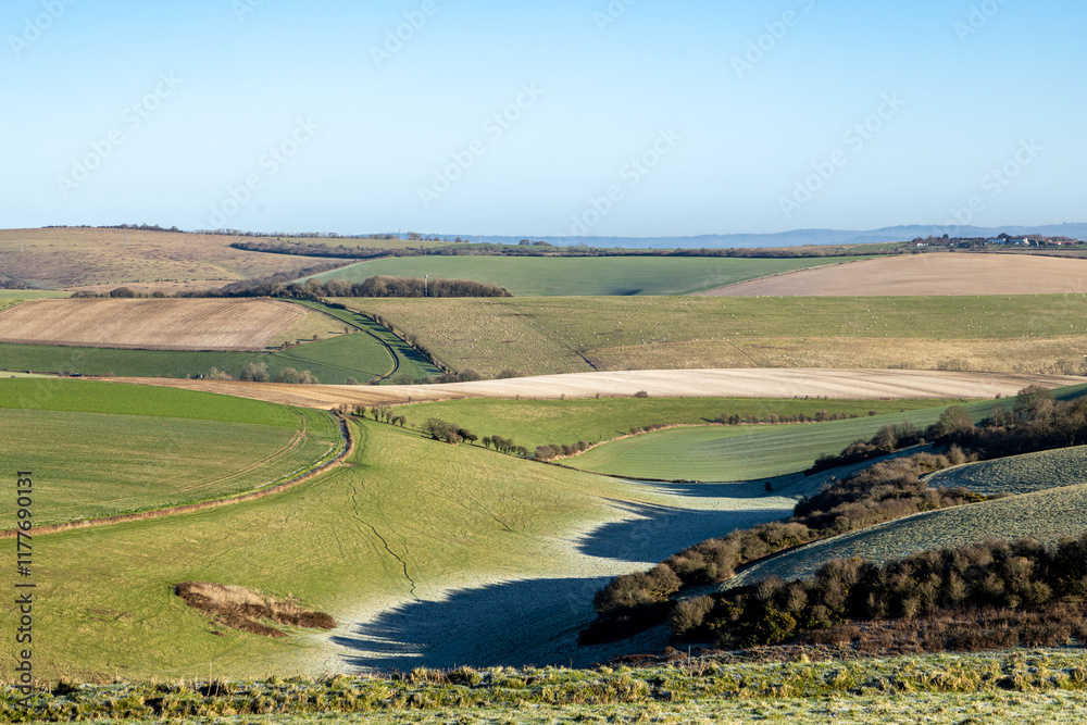 Naklejka premium Looking out over farmland in rural Sussex on a sunny but cold January morning