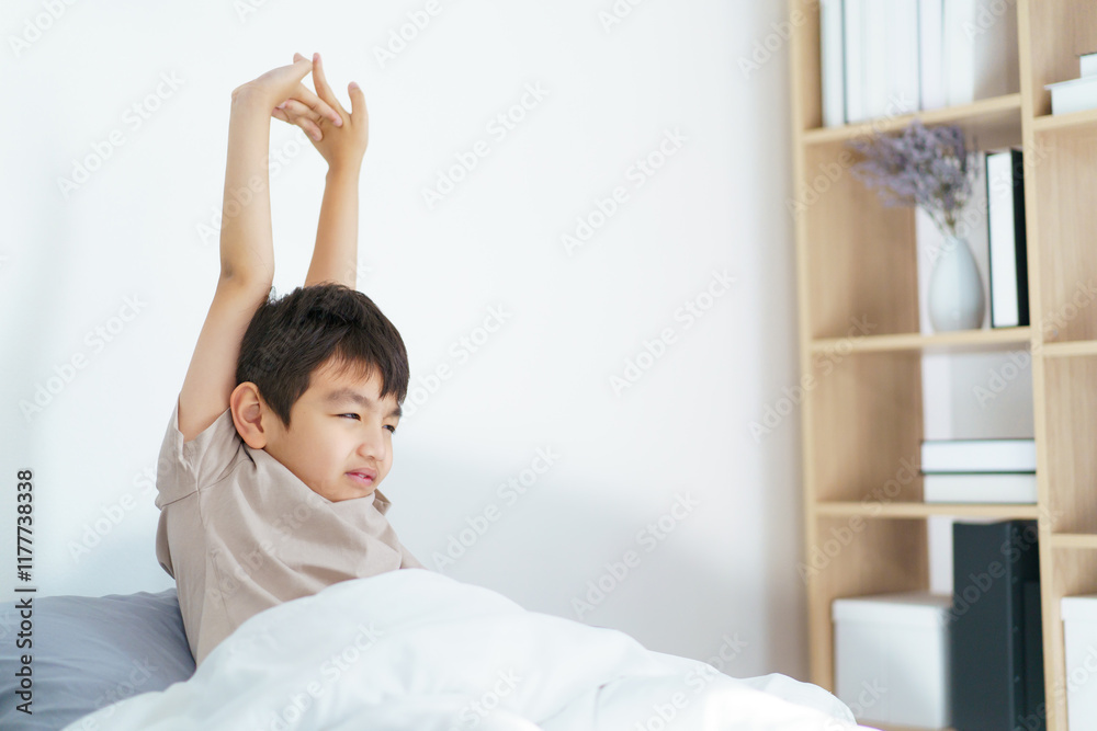 Asian little boy wakes up in morning. Asian little boy wakes up in morning.