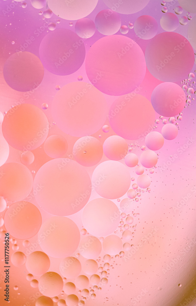 Beautiful cosmetic background. Pink lilac abstract oil bubbles or face serum background. Beautiful cosmetic background. Pink lilac abstract oil bubbles or face serum background.
