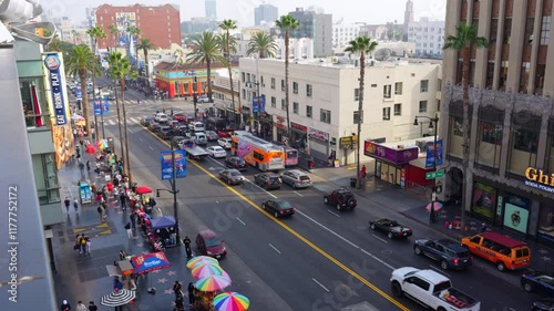 Los Angeles, California - December 24, 2024: Aerial view of Hollywood Boulevard filled with traffic and colorful market umbrellas in Los Angeles.