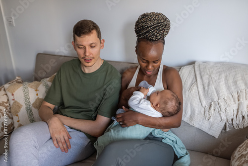 Candid couple talking on couch at home photo