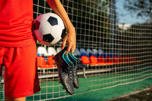 Female soccer player on a sports field photo