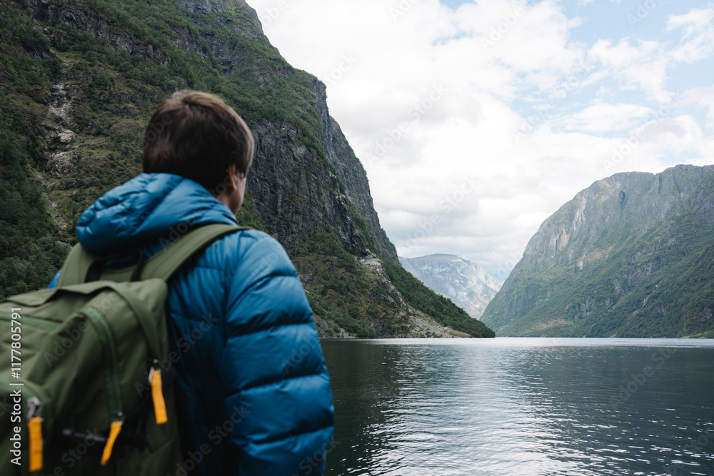 A tourist in at fjord in Gudvangen in Norway