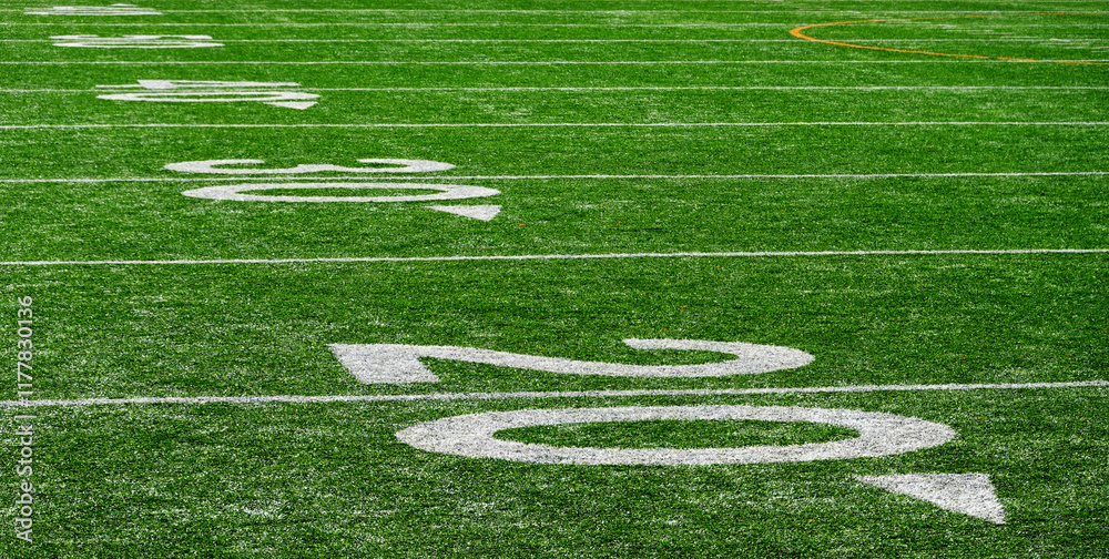 Fototapeta premium Football Field with Yardage Markers on Turf for Competition and Entertainment