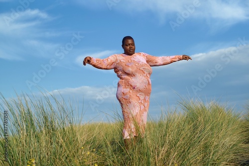 Joyful sunset celebration dance in vibrant dress photo