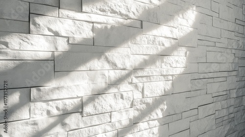 Clean white brick wall with streaks of light creating a textured, modern aesthetic in an indoor space photo