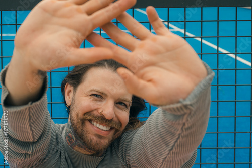 Cheerful man stretching arms photo