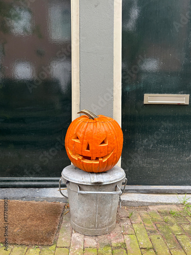 jack-o-lantern in front of doors photo