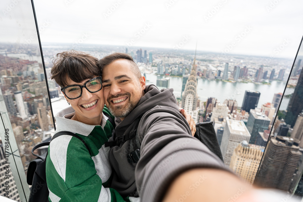 Cheerful tourists taking a selfie with manhattan cityscape Cheerful tourists taking a selfie with manhattan cityscape